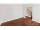 Living room with hardwood floors and view of staircase at 3273 Bending Birch Pl, Charlotte, NC 28206