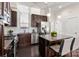 Modern kitchen with dark cabinets, granite island, and stainless appliances at 3507 Spencer St, Charlotte, NC 28205