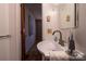 Compact bathroom with a sink, modern faucet, and white walls for a clean and functional space at 3581 Thompson St, Newton, NC 28658