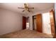 Neutral bedroom featuring a ceiling fan, closet, and ensuite bathroom at 3581 Thompson St, Newton, NC 28658