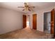 A cozy bedroom features carpeted floors, ceiling fan, closet, and natural light from a window at 3581 Thompson St, Newton, NC 28658