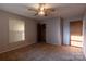 This bedroom offers carpeted floors, a ceiling fan, closet, and natural light from a window at 3581 Thompson St, Newton, NC 28658