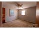 Cozy bedroom featuring carpet floors, a ceiling fan, and a window for natural light at 3581 Thompson St, Newton, NC 28658