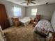 Bedroom with two beds, a ceiling fan, and boxes at 3581 Thompson St, Newton, NC 28658