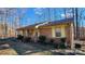 Brick ranch house with covered porch and mature trees at 3581 Thompson St, Newton, NC 28658
