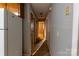 Hallway in home with wood doors and gray textured walls at 3581 Thompson St, Newton, NC 28658