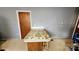 Kitchen island with floral countertop and wood cabinets at 3581 Thompson St, Newton, NC 28658