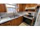 Stainless steel stove and oven with wood cabinets at 3581 Thompson St, Newton, NC 28658
