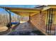 Covered porch with concrete flooring and wrought iron railing at 3581 Thompson St, Newton, NC 28658
