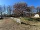 Spacious backyard with a large tree and storage shed at 3610 Becky Ln, Monroe, NC 28112