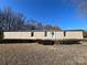 Single-wide mobile home with landscaping and a brick walkway at 3610 Becky Ln, Monroe, NC 28112