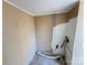 Small laundry room with unfinished walls and flooring at 3610 Becky Ln, Monroe, NC 28112