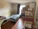 Bedroom with a bed, window, and stacked storage boxes at 372 Forest Hollow Dr, Statesville, NC 28677