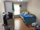 bedroom with a bed, toys and window coverings at 372 Forest Hollow Dr, Statesville, NC 28677