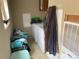 Laundry room with washer, dryer, and ample storage at 372 Forest Hollow Dr, Statesville, NC 28677
