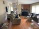 Living room with a sofa, TV, and stone fireplace at 372 Forest Hollow Dr, Statesville, NC 28677