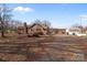 View of brick home, driveway, and shed on an expansive lot at 40503 Millingport Rd, Richfield, NC 28137