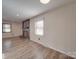 Living room with hardwood floors and a modern fireplace at 4539 Sapp Rd, Kannapolis, NC 28083