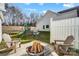 Fenced backyard with fire pit, playset, and patio at 5113 Park Place Dr, Dallas, NC 28034