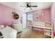 Cozy bedroom with a bunk bed, dresser, and pink walls at 5113 Park Place Dr, Dallas, NC 28034