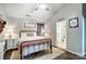 Comfortable bedroom with a metal bed frame, dresser, and ensuite bathroom at 5113 Park Place Dr, Dallas, NC 28034