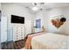 Relaxing bedroom with a metal bed frame, dresser, and ceiling fan at 5113 Park Place Dr, Dallas, NC 28034