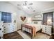 Spacious bedroom with a metal bed frame, dresser, and ceiling fan at 5113 Park Place Dr, Dallas, NC 28034
