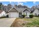 Charming one-story house with attached garage and well-manicured lawn at 5113 Park Place Dr, Dallas, NC 28034