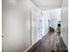 Clean hallway with hardwood floors and access to other rooms at 5113 Park Place Dr, Dallas, NC 28034