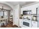 Eat-in kitchen with white cabinets, granite countertops, and stainless steel appliances at 5113 Park Place Dr, Dallas, NC 28034