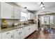 White kitchen cabinets, granite countertops and breakfast area at 5113 Park Place Dr, Dallas, NC 28034