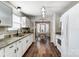 Modern kitchen with white cabinets, granite countertops, and a breakfast nook at 5113 Park Place Dr, Dallas, NC 28034