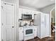 Bright kitchen with white cabinets, granite countertops, and stainless steel appliances at 5113 Park Place Dr, Dallas, NC 28034