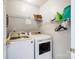 Bright laundry room with washer, dryer and storage at 5113 Park Place Dr, Dallas, NC 28034