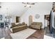 Living room with vaulted ceiling and neutral colored couches at 5113 Park Place Dr, Dallas, NC 28034