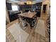 Open kitchen design with dark cabinets and a wooden island for seating at 5122 Wrenn Dr, Denver, NC 28037