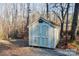 Exterior view of a shed with double doors in a wooded backyard at 5122 Wrenn Dr, Denver, NC 28037
