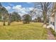 Spacious backyard featuring lush grass and mature trees at 5300 Lansing Dr, Charlotte, NC 28270