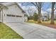 Large concrete driveway leads to a two car garage at 5300 Lansing Dr, Charlotte, NC 28270