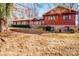 Ranch style home with brick and wood siding, situated on a large lot with mature trees at 5836 Grace Chapel Rd, Hickory, NC 28601