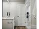Bathroom featuring white vanity and wood-look flooring at 604 Cassidy Ct, Clover, SC 29710