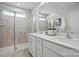 Bright bathroom featuring a glass shower and dual vanity with white countertops at 604 Cassidy Ct, Clover, SC 29710