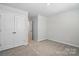 Bright bedroom with neutral carpeting and ample natural light from the windows at 604 Cassidy Ct, Clover, SC 29710