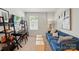 Cozy bedroom features a comfortable blue sofa, desk, and shelving for storage at 604 Cassidy Ct, Clover, SC 29710