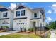 Beautiful two-story home showcasing white siding, black shutters, and a manicured lawn at 604 Cassidy Ct, Clover, SC 29710
