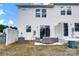 Home's rear exterior with outdoor patio seating area and partial fence at 604 Cassidy Ct, Clover, SC 29710