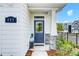 Charming front porch with stone accents, a stylish blue door, and a 'welcome' mat at 604 Cassidy Ct, Clover, SC 29710