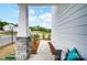 Cozy front porch featuring stone pillar accents and views of the surrounding neighborhood at 604 Cassidy Ct, Clover, SC 29710