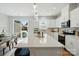Spacious kitchen with an island, pendant lighting, stainless steel appliances, and sliding glass doors at 604 Cassidy Ct, Clover, SC 29710