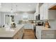 Bright kitchen featuring a central island, recessed lighting, and a sleek cooktop at 604 Cassidy Ct, Clover, SC 29710